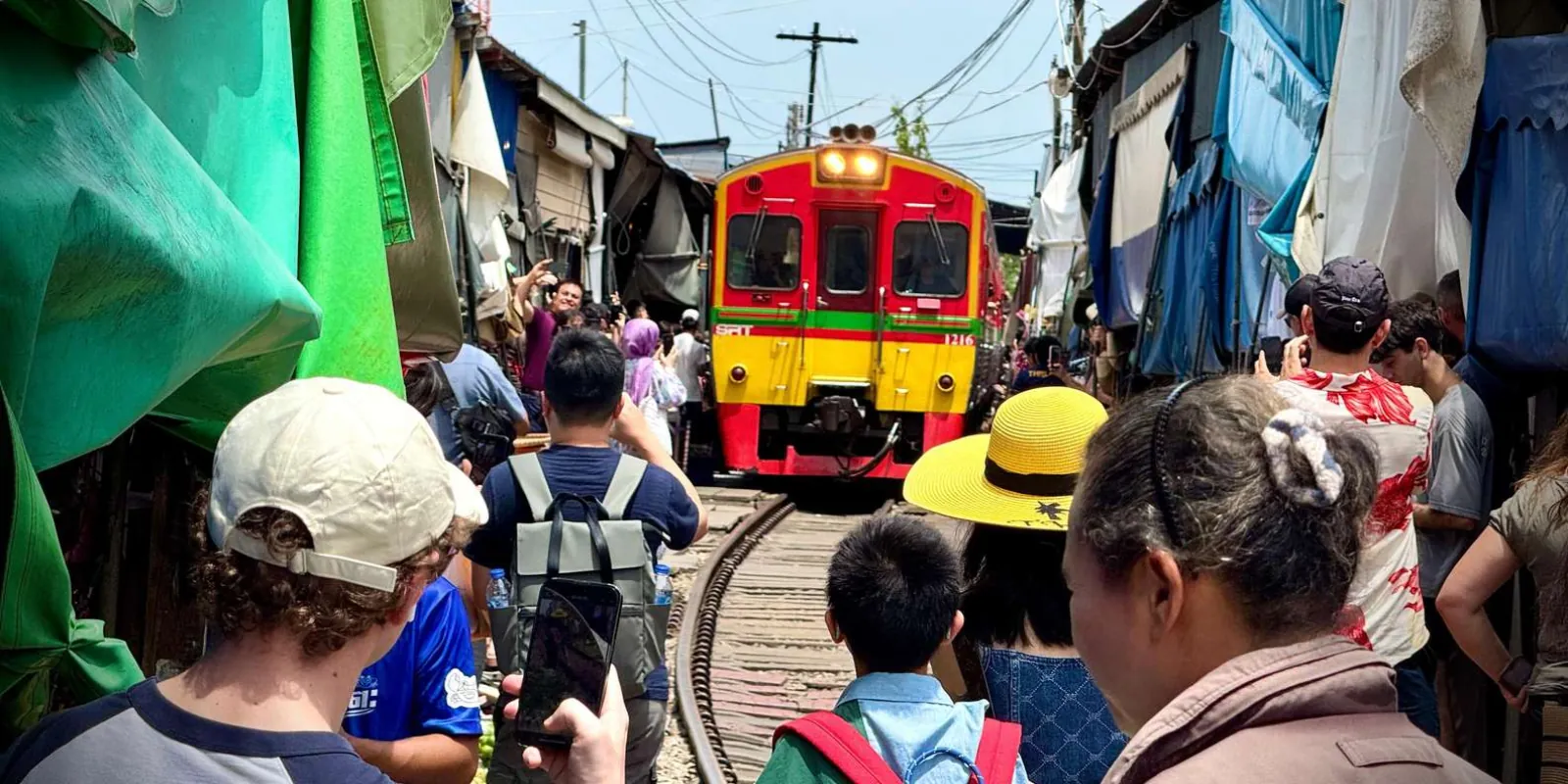 Visitors watching the train approach the market