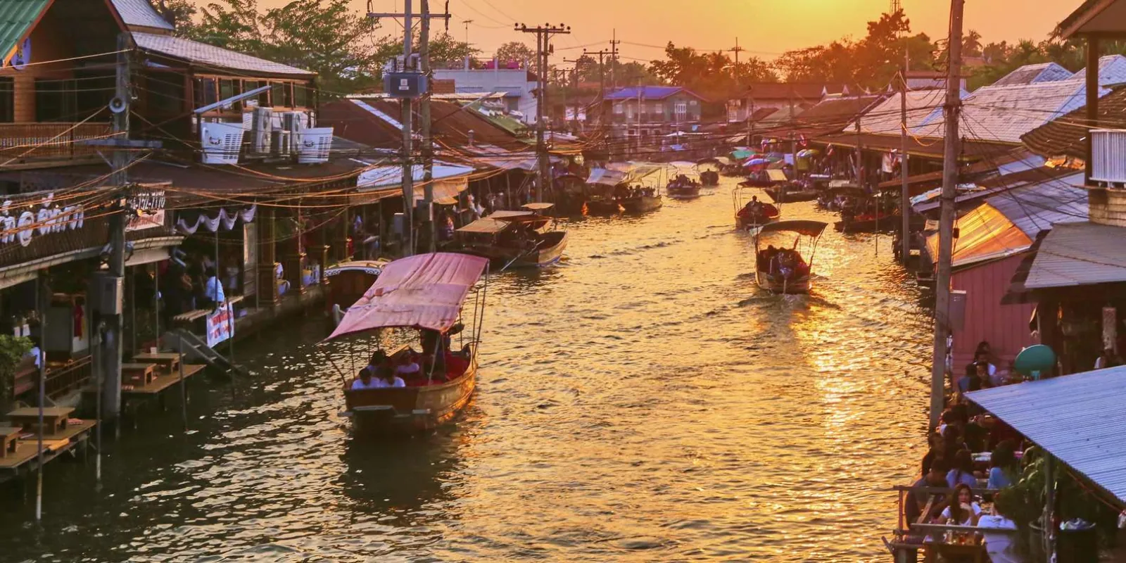 Boats on the Amphawa canal near sunset