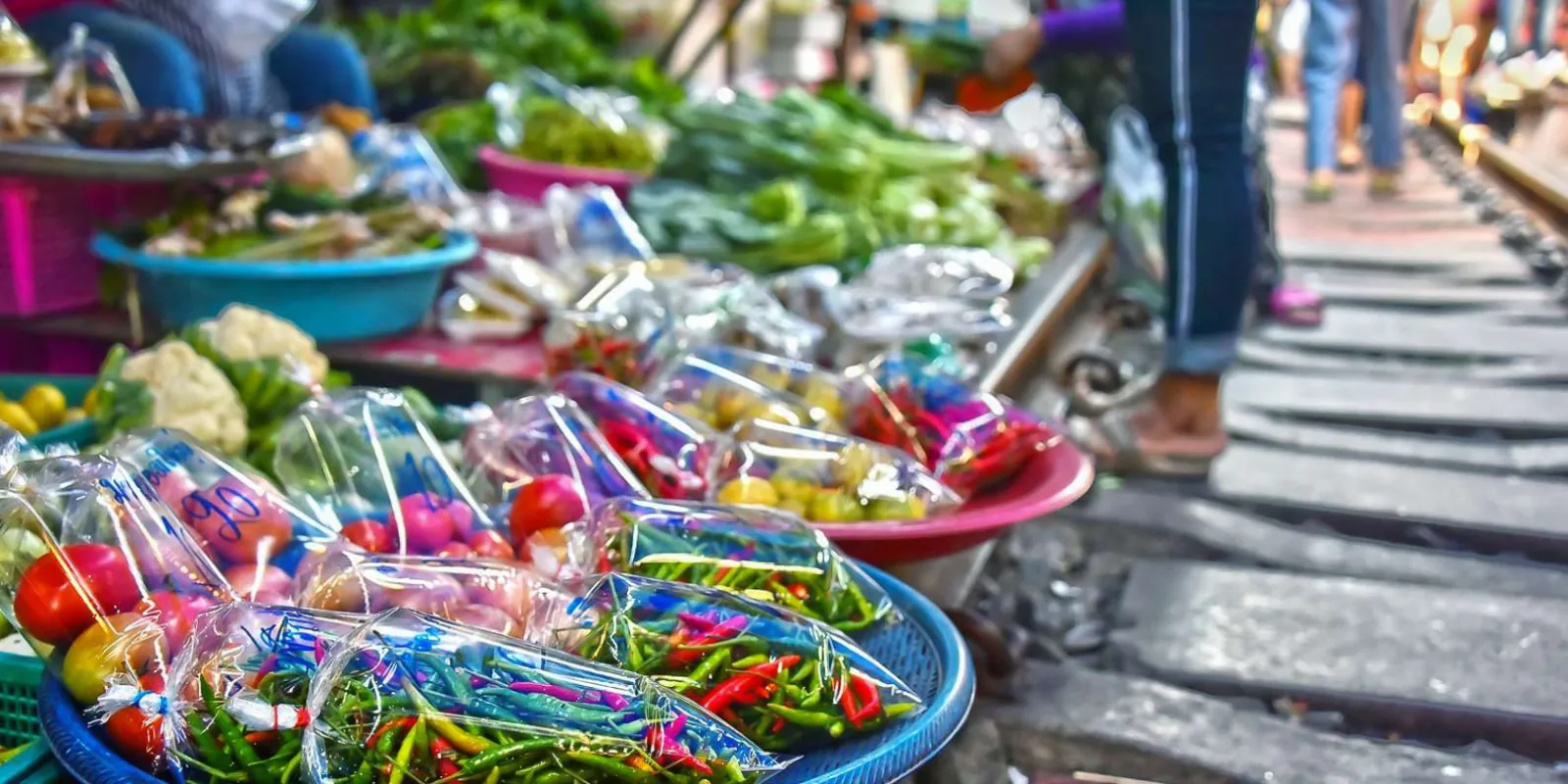 Packaged produce displayed beside the railway